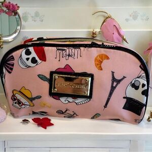 Betsey Johnson pink make up case with bicycle skulls and Eiffel Tower